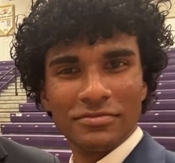 Visualize a handyman efficiently repairing a wall, demonstrating skill and expertise in action. The light should focus on the repair area, showcasing the detailed work. Capture this moment at a close range to emphasize the quality and determination in every stroke.